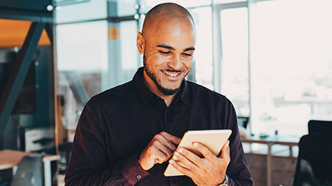 A travel consultant checking info on a tablet device