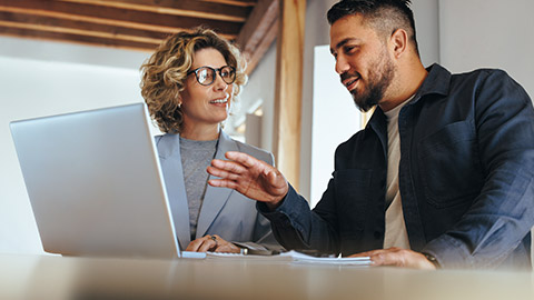 A business person talking to a colleague