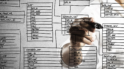 A person drawing a database diagram