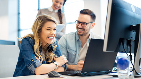 Group of business people and software developers working as a team in office