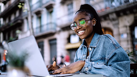 Colored woman happily on video conference