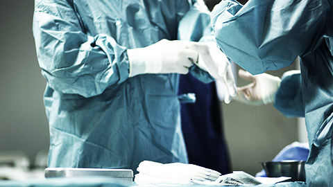 A surgeon wearing gloves before surgery