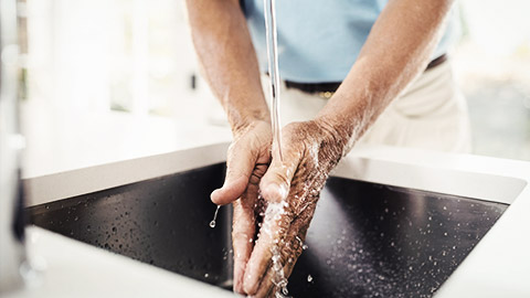 A person washing hands