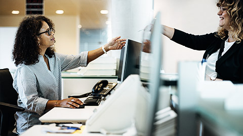 A receptionist getting payments