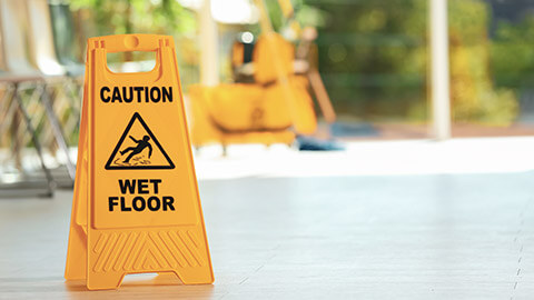 A sign warning of the danger of a wet floor