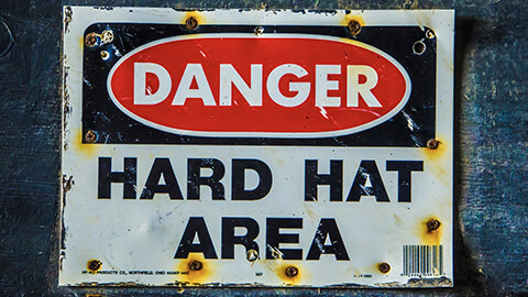 A close view of a danger sign on a wall