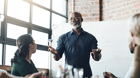 Presentation, man and meeting on whiteboard in office for feedback