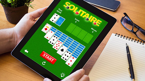 A person playing solitaire