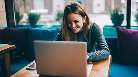 A designer enjoying web content on a laptop computer