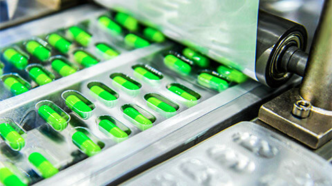 Pharmaceuticals being packaged in a manufacturing facility