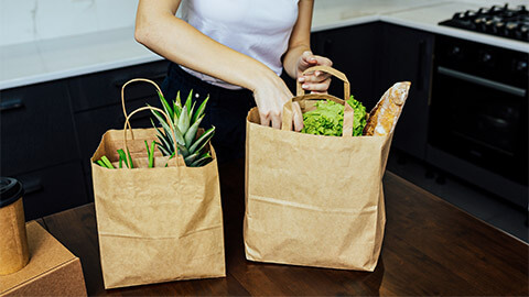 A person unpacking their groceries after visiting the local supermarket