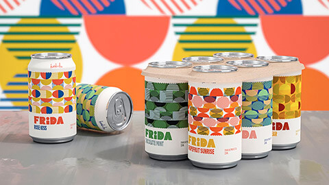 A mockup of several cans of a new product sitting on a table