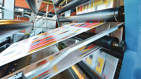 A close view of an offset printing press