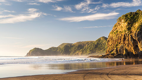 A view of a New Zealand beach at sunrise