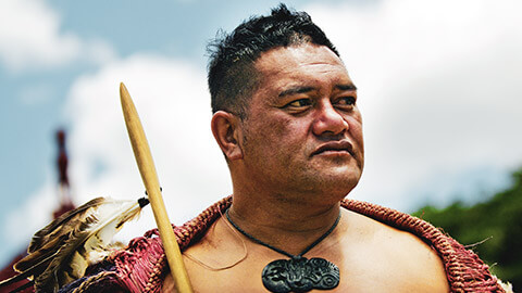 A maori man wearing a traditional outfit