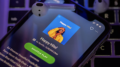 A close view of a mobile phone with Spotify on the screen