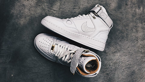 A pair of snake skin Nike Air Force Ones