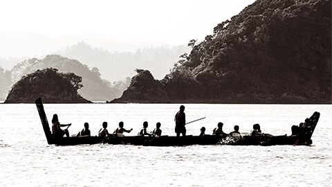 A traditional New Zealand Maori waka boat on the sea in the Bay of islands, New Zealand