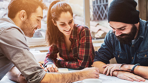 3 designers working on a project collaboratively