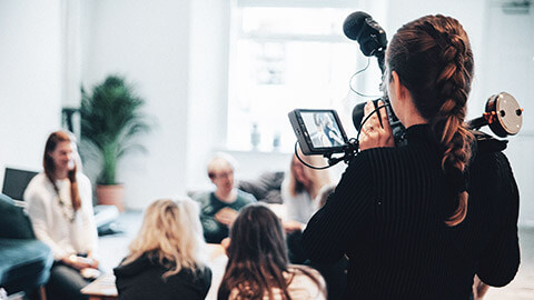 A young filmaker doing a job for a client