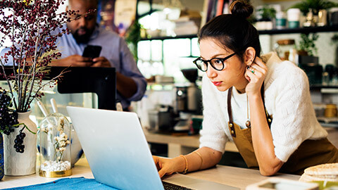 A business owner working on the business website