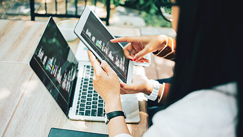 A pair of prgrammers testing code on various devices