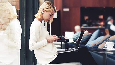 A person interacting with their phone in a relaxed environment