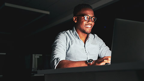 An IT person checking a network connection on a laptop