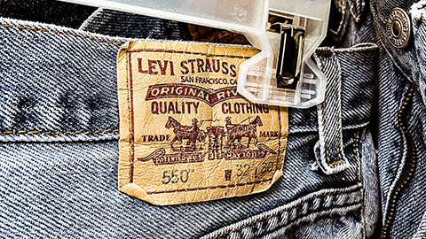 A Levis logo, stiched on to the back of a pair of their iconic jeans