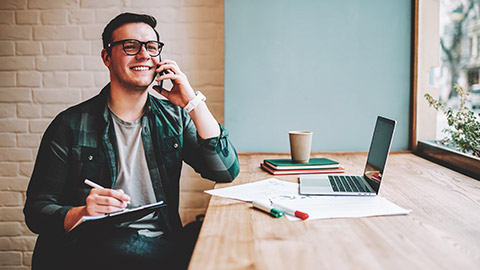 A programmer talking to a client and discussing a project