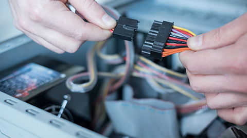 Professional man repairing and assembling a computer desktop