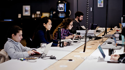 A group of coworkers in a modern office space