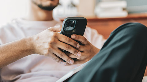 A close view of a user testing an app on a phone