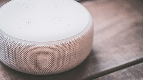 A close view of a smart speaker sitting on a table