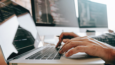 A developer working on a laptop