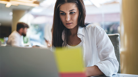 A designer working on a computer in an office