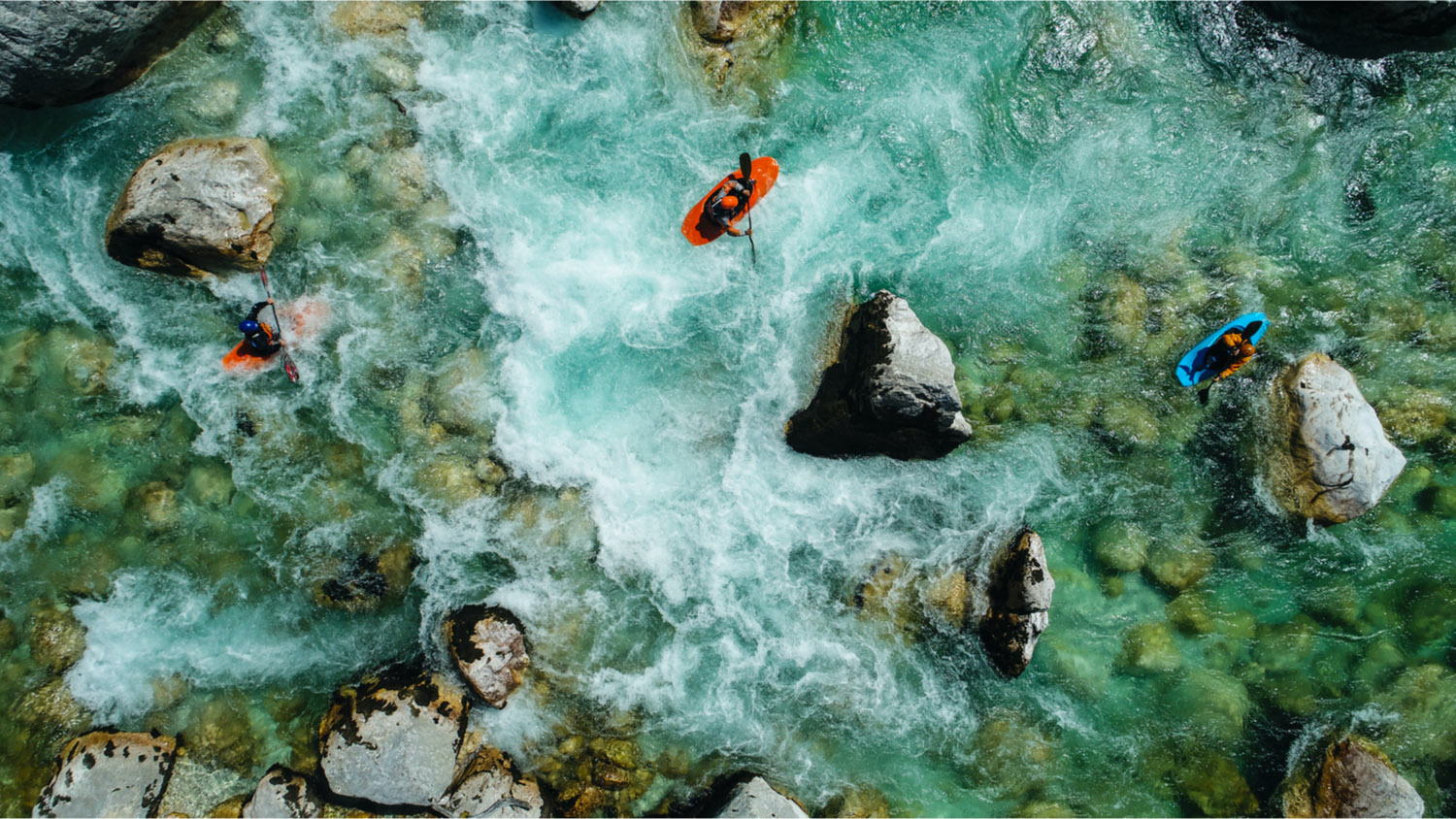 3 people whitewater kayaking