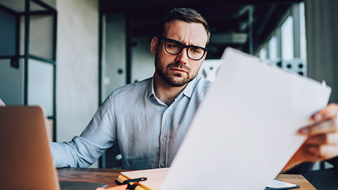 Businessman checking over a document