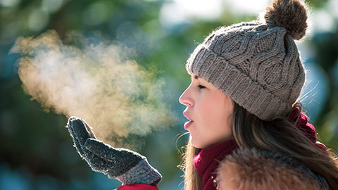 girl breathing in cold weather