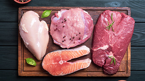 varieties of white meat on a cutting board