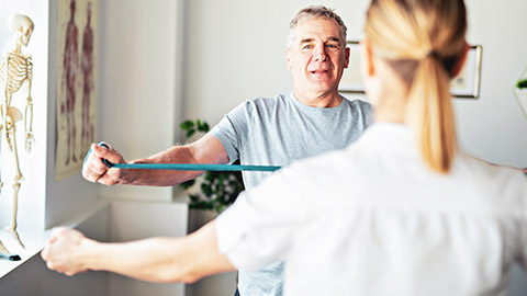 Mature client in physiotherapist office