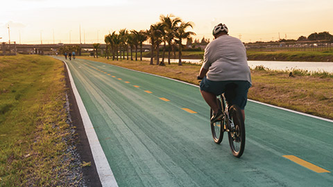 Obese man on a bike