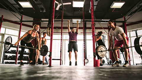 group of athletes working out in a gym