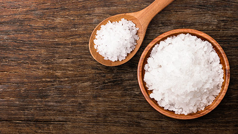 container of sea salt on a table