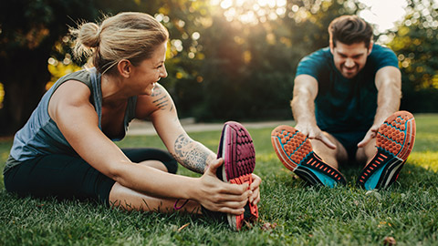 Young couple exercising outside