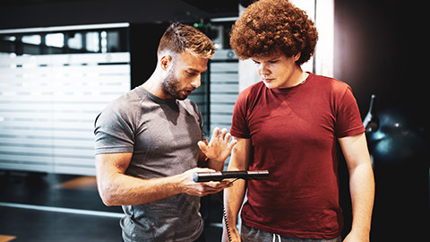 Trainer with young male client