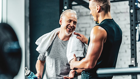 A young personal trainer having a conversation with their client
