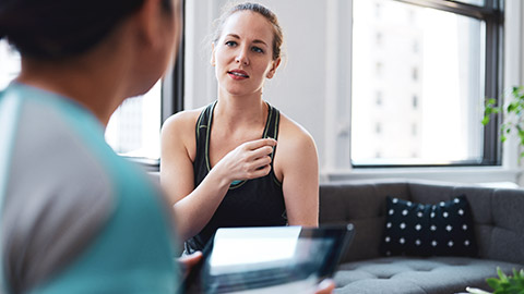 Trainer talking to client