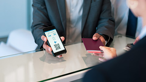 businessman checking in with smartphone boarding pass