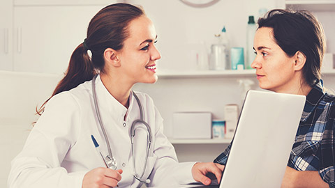 female doctor consulting with patient